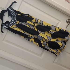 Black and yellow dress with beads around neck